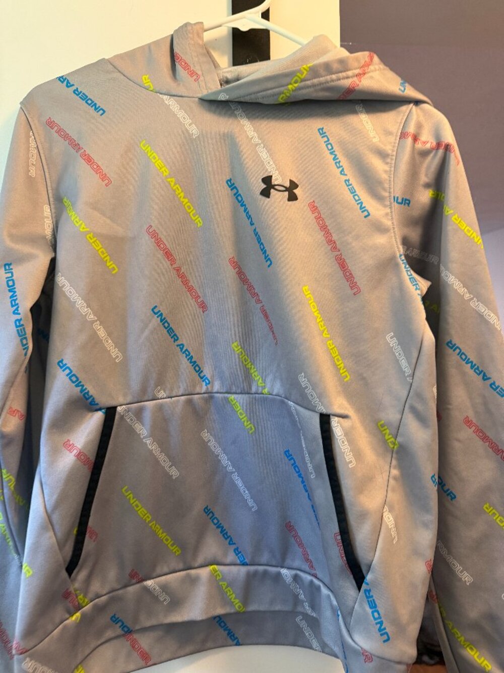 Gray Under Armour Boys Hoodie with Under Armour Written All Over It